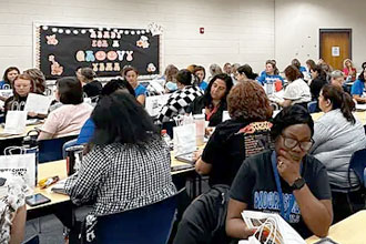 Some of Mooresville’s Student Services staff attend a meeting together.