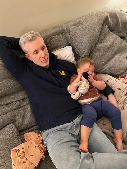 Nick and his youngest daughter hanging out at home.